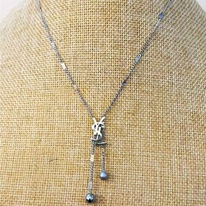Unbranded necklace 18 carat silver plated “YSL” necklace.